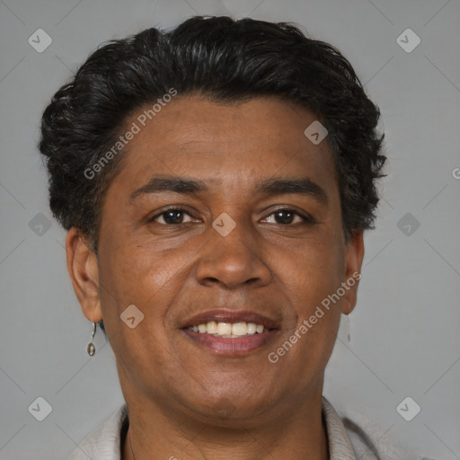 Joyful latino adult male with short  brown hair and brown eyes