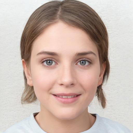 Joyful white young-adult female with medium  brown hair and blue eyes