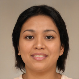 Joyful asian young-adult female with medium  brown hair and brown eyes