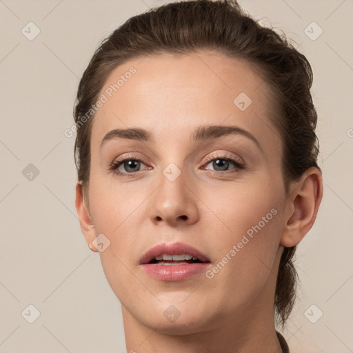 Neutral white young-adult female with short  brown hair and brown eyes