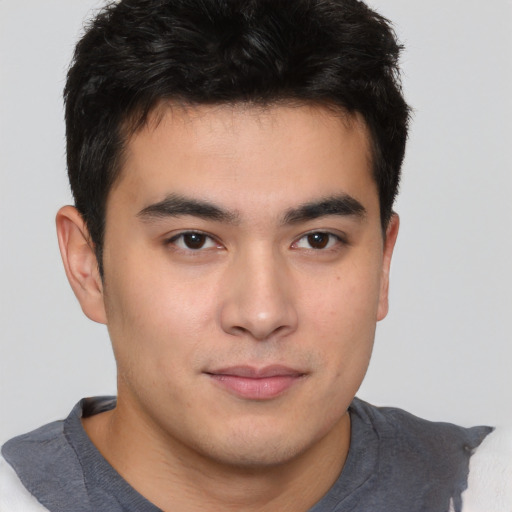 Joyful asian young-adult male with short  brown hair and brown eyes