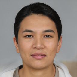 Joyful asian young-adult male with short  black hair and brown eyes