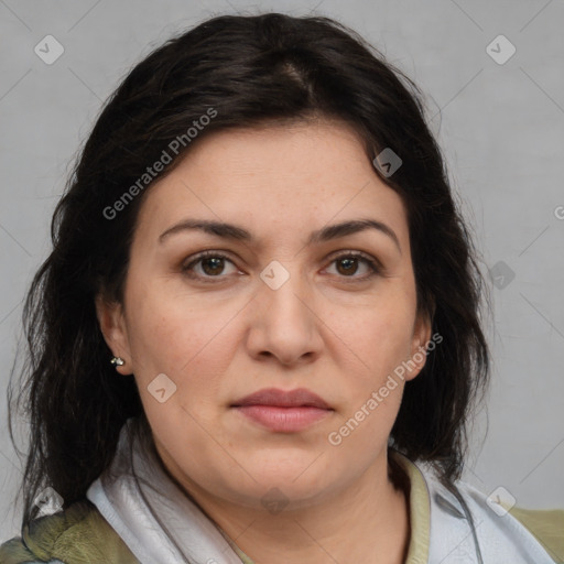 Joyful white adult female with medium  brown hair and brown eyes