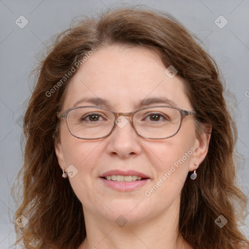 Joyful white adult female with medium  brown hair and brown eyes