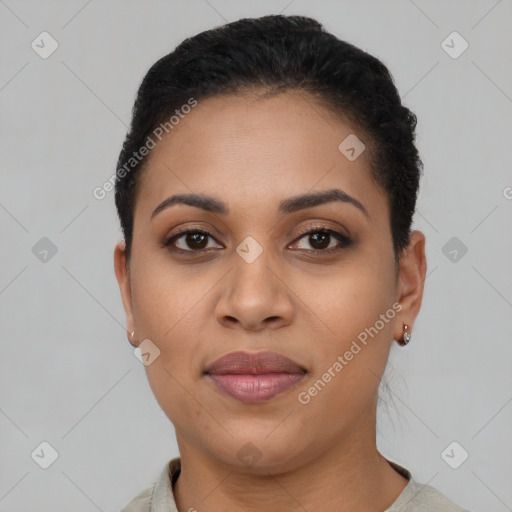 Joyful latino young-adult female with short  black hair and brown eyes