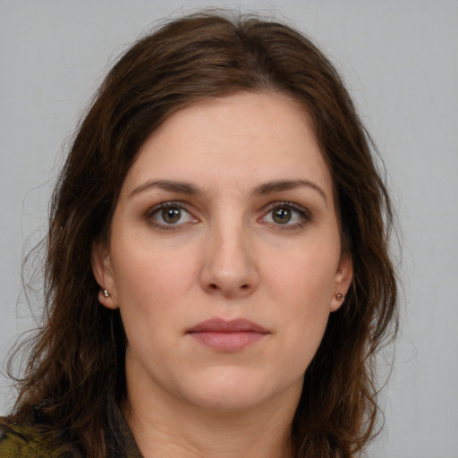 Neutral white young-adult female with long  brown hair and brown eyes