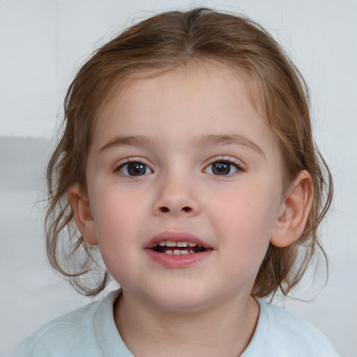 Joyful white child female with medium  brown hair and blue eyes