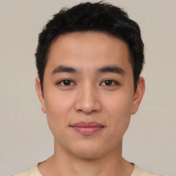 Joyful asian young-adult male with short  black hair and brown eyes