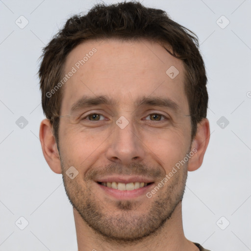 Joyful white adult male with short  brown hair and brown eyes