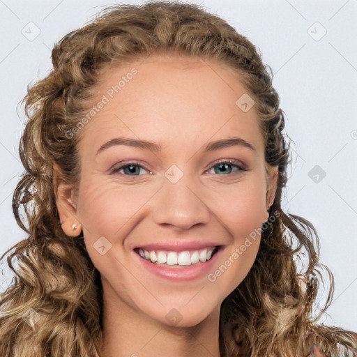 Joyful white young-adult female with long  brown hair and blue eyes