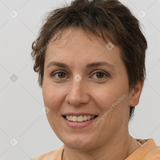 Joyful white adult female with short  brown hair and brown eyes