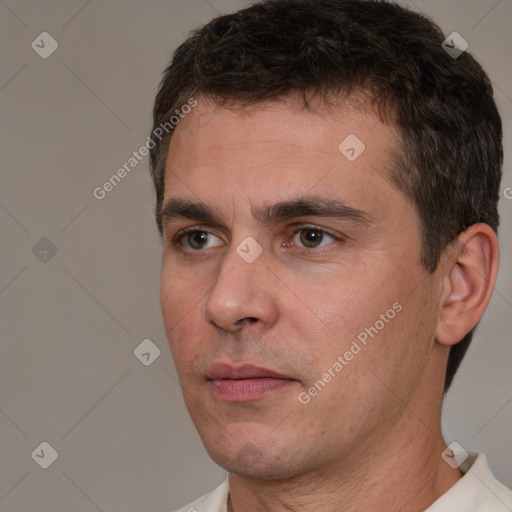 Neutral white adult male with short  brown hair and brown eyes