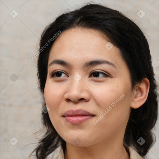 Joyful asian young-adult female with medium  brown hair and brown eyes