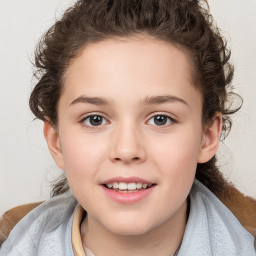 Joyful white child female with medium  brown hair and brown eyes