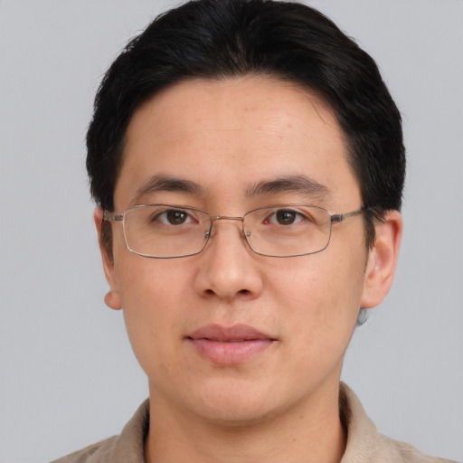 Neutral asian adult male with short  brown hair and brown eyes