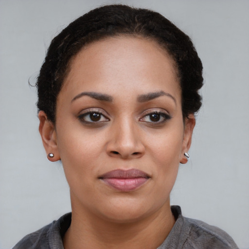 Joyful asian young-adult female with short  black hair and brown eyes