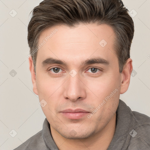 Neutral white young-adult male with short  brown hair and brown eyes