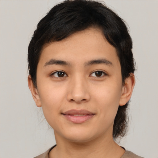 Joyful asian young-adult female with medium  black hair and brown eyes