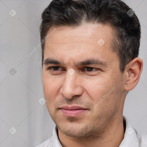 Joyful white adult male with short  brown hair and brown eyes