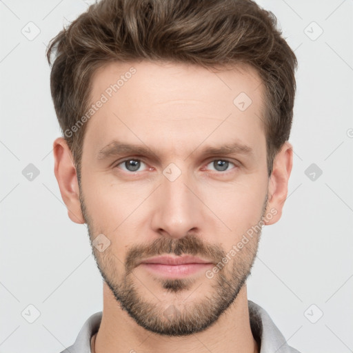 Neutral white young-adult male with short  brown hair and grey eyes