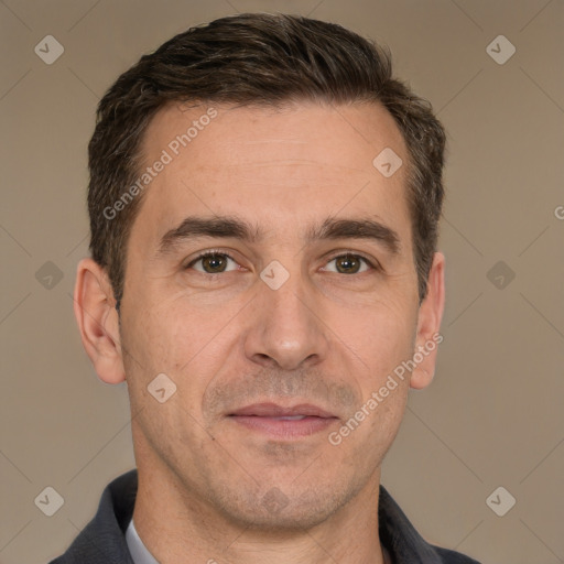 Joyful white adult male with short  brown hair and brown eyes