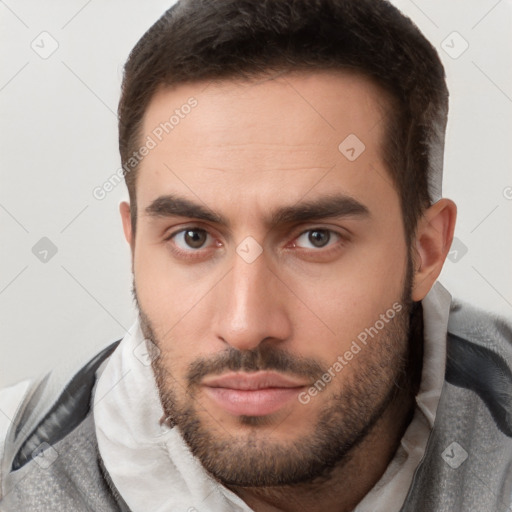 Neutral white young-adult male with short  brown hair and brown eyes