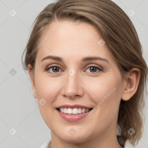 Joyful white young-adult female with medium  brown hair and grey eyes