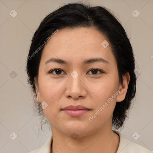 Joyful asian young-adult female with medium  brown hair and brown eyes