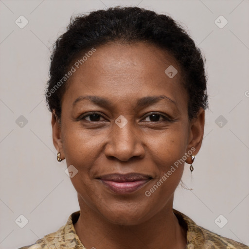 Joyful black adult female with short  brown hair and brown eyes