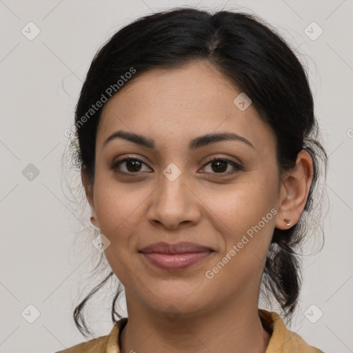 Joyful latino young-adult female with medium  brown hair and brown eyes