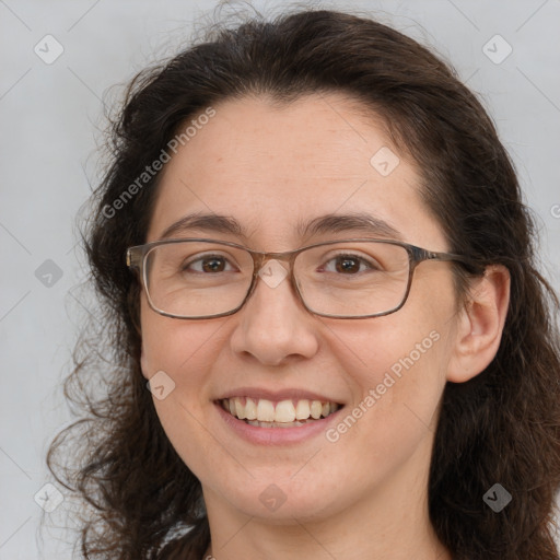 Joyful white adult female with long  brown hair and brown eyes