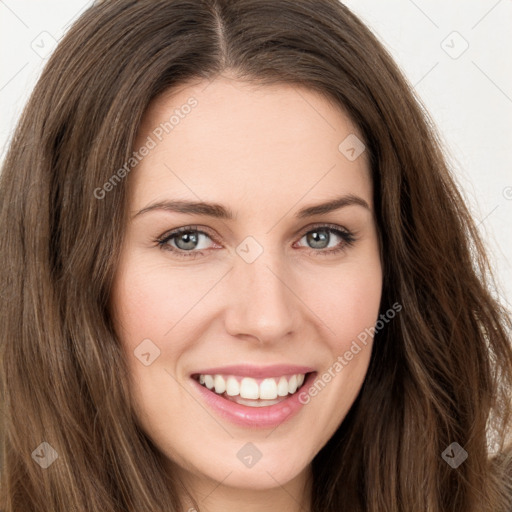 Joyful white young-adult female with long  brown hair and green eyes