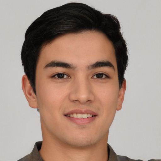 Joyful asian young-adult male with short  black hair and brown eyes