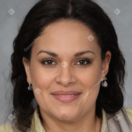 Joyful latino adult female with long  brown hair and brown eyes