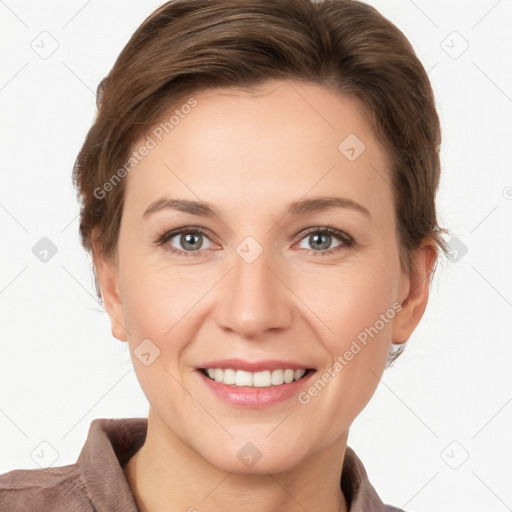 Joyful white young-adult female with short  brown hair and grey eyes