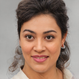 Joyful white young-adult female with medium  brown hair and brown eyes