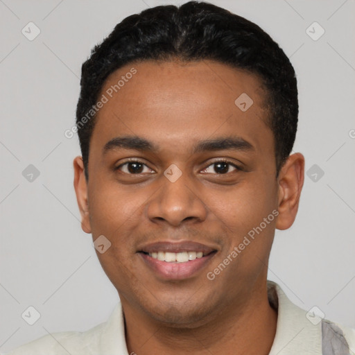 Joyful black young-adult male with short  black hair and brown eyes