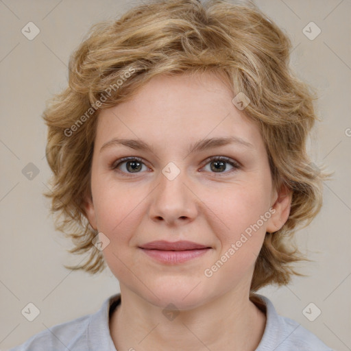 Joyful white child female with medium  brown hair and brown eyes