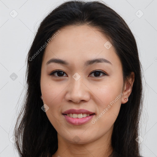 Joyful asian young-adult female with long  brown hair and brown eyes