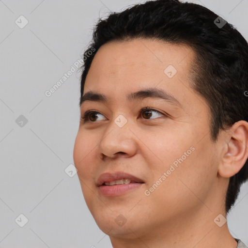 Joyful white young-adult male with short  black hair and brown eyes