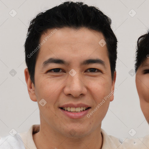 Joyful asian young-adult male with short  brown hair and brown eyes