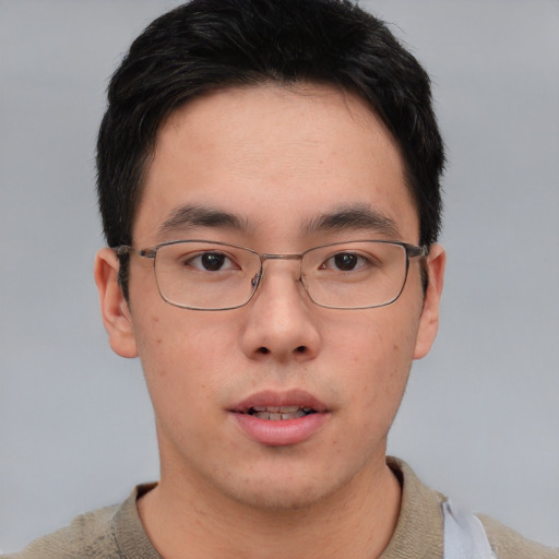 Neutral asian young-adult male with short  brown hair and brown eyes