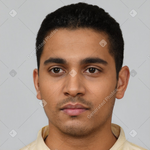 Neutral latino young-adult male with short  black hair and brown eyes