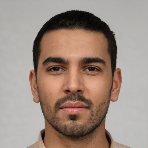 Neutral latino young-adult male with short  black hair and brown eyes