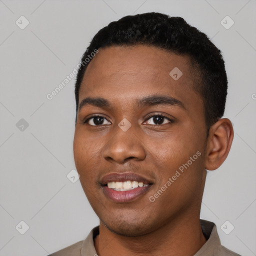 Joyful black young-adult male with short  black hair and brown eyes