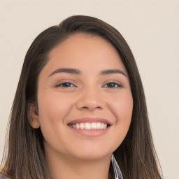 Joyful white young-adult female with long  black hair and brown eyes