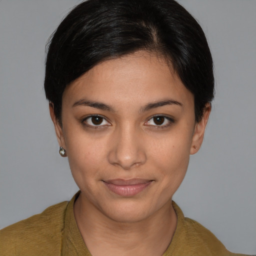 Joyful latino young-adult female with short  brown hair and brown eyes