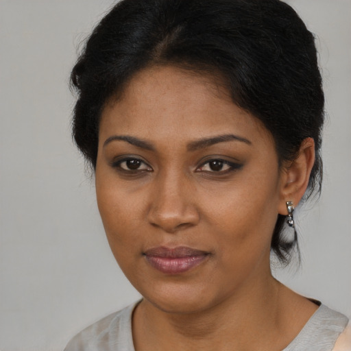 Neutral black young-adult female with medium  brown hair and brown eyes