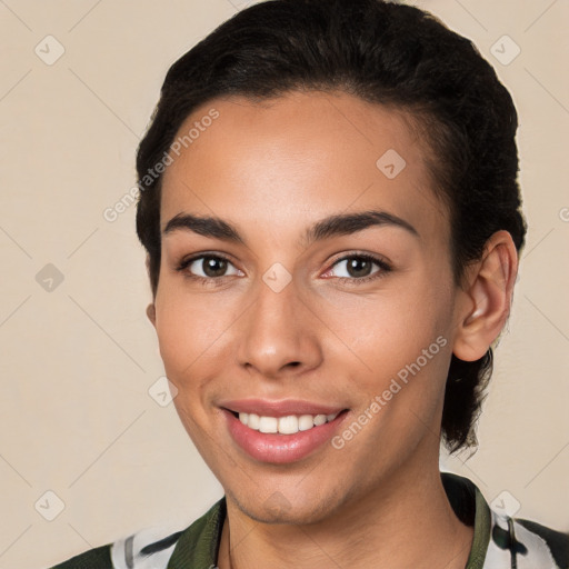 Joyful white young-adult female with short  brown hair and brown eyes