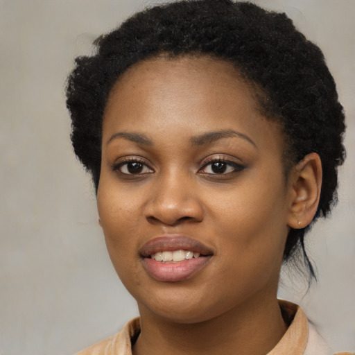 Joyful black young-adult female with medium  black hair and brown eyes